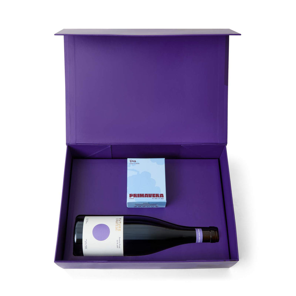 Open Future Château x Earl of East gift box with a bottle of Reserve Rouge and a boxed Uva scented candle