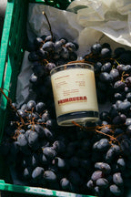 Earl of East Uva scented candle in a crate of red grapes